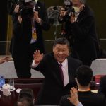 
              FILE - Chinese President Xi Jinping waves as he attends a gala show ahead of the 100th anniversary of the founding of the Chinese Communist Party in Beijing on Monday, June 28, 2021. The Chinese president, hosting the 2022 Winter Olympics beleaguered by complaints about human rights abuses, has upended tradition to restore strongman rule in China and tighten Communist Party control over the economy and society. (AP Photo/Ng Han Guan, File)
            