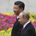 
              FILE - Russia's President Vladimir Putin, right, reviews a military honor guard with Chinese President Xi Jinping during a welcoming ceremony outside the Great Hall of the People in Beijing, June 8, 2018. Amid the soaring tensions over Ukraine, President Vladimir Putin is heading to Beijing on a trip intended to help strengthen Russia's ties with China and coordinate their policies amid Western pressure. (Greg Baker/Pool Photo via AP, File)
            