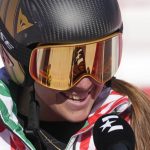 
              Sofia Goggia, of Italy smiles as she is interviewed after finishing women's downhill training at the 2022 Winter Olympics, Monday, Feb. 14, 2022, in the Yanqing district of Beijing. (AP Photo/Luca Bruno)
            