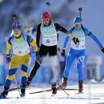 
              Mona Brorsson of Sweden, left, Vanessa Hinz of Germany and Dorothea Wierer of Italy ski onto the shooting range during the women's 4x6-kilometer relay at the 2022 Winter Olympics, Wednesday, Feb. 16, 2022, in Zhangjiakou, China. (AP Photo/Frank Augstein)
            