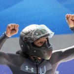
              FILE- Elana Meyers Taylor, of the United States, celebrates after the women's monobob heat 4 at the 2022 Winter Olympics, Monday, Feb. 14, 2022, in the Yanqing district of Beijing. “I never really wanted to break any of them,” she said when her fourth Olympic medal passed teven Holcomb's U.S. record “He’s part of the reason I’m here to begin with. He guided me through most of my career. I wouldn’t be here without him. That’s all I can say. To be in that kind of company is just incredible.” (AP Photo/Pavel Golovkin, File)
            