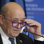 
              France's European and Foreign Affairs Minister Jean-Yves Le Drian listens to a reporter asking questions during a joint press conference with Romanian counterpart Bogdan Aurescu in Bucharest, Romania, Thursday, Feb.3, 2022. (AP Photo/Andreea Alexandru)
            