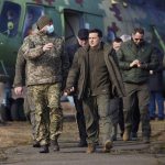 
              Ukrainian President Volodymyr Zelenskyy, center, arrives to attend a military drill outside the city of Rivne, northern Ukraine, Wednesday, Feb. 16, 2022. (Ukrainian Presidential Press Office via AP)
            