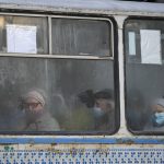 
              People travel in a tram in Sievierodonetsk, the Luhansk region, eastern Ukraine, Thursday, Feb. 24, 2022. Russian President Vladimir Putin on Thursday announced a military operation in Ukraine and warned other countries that any attempt to interfere with the Russian action would lead to "consequences you have never seen." (AP Photo/Vadim Ghirda)
            