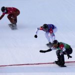 
              United States' Lindsey Jacobellis (5), followed by France's Chloe Trespeuch (8) and Canada's Meryeta O'Dine (3) crosses the finish line to win a gold medal during the women's cross final at the 2022 Winter Olympics, Wednesday, Feb. 9, 2022, in Zhangjiakou, China. (AP Photo/Lee Jin-man)
            