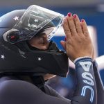
              Elana Meyers Taylor, of the United States, celebrates after her women's monobob heat 4 at the 2022 Winter Olympics, Monday, Feb. 14, 2022, in the Yanqing district of Beijing. (AP Photo/Mark Schiefelbein)
            
