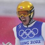 
              Franz-Josef Rehrl, of Austria, celebrates after his jump during the team Gundersen large hill/4x5km ski jumping competition round at the 2022 Winter Olympics, Thursday, Feb. 17, 2022, in Zhangjiakou, China. (AP Photo/Matthias Schrader)
            