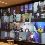 
              A screen shows leader during a video-conference of NATO members at the French Army headquarters, Friday, Feb. 25, 2022 in Paris. NATO leaders met to discuss how far they can go to challenge Russian President Vladimir Putin without engaging Russian forces in direct war. (AP Photo/Michel Euler, Pool)
            