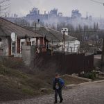 
              The Azovstal metallurgical plant is seen on the outskirts of the eastern Ukrainian city of Mariupol, Wednesday, Feb. 23, 2022. Russia began evacuating its embassy in Kyiv, and Ukraine urged its citizens to leave Russia. Those moves come as the region braced for further confrontation Wednesday after President Vladimir Putin received authorization to use military force outside his country. (AP Photo/Sergei Grits)
            