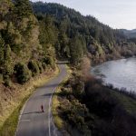 
              In this aerial image taken from a drone, a pedestrian walks near End of Road on Jan. 19, 2022, where Emmilee Risling was last seen before going missing in October 2021, in Klamath, Calif. The Yurok Tribe has issued an emergency declaration on human trafficking and missing women. There have been five instances in the past 18 months where Indigenous women have gone missing or been murdered between San Francisco and the Oregon border. (AP Photo/Nathan Howard)
            
