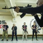 
              An instructor shows how to use weapons to a group of women during training in Kharkiv, Ukraine, Sunday, Jan. 30, 2022. Some people in Ukraine's second-largest city are preparing to fight back if Russia invades. Kharkiv is just 40 kilometers (25 miles) from some of the tens of thousands of Russian troops massed at the border. (AP Photo/Evgeniy Maloletka)
            