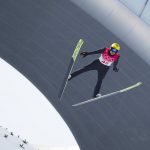 
              Vinzenz Geiger, of Germany, soars through the air during a trial round in the ski jump portion of the individual Gundersen normal hill event at the 2022 Winter Olympics, Wednesday, Feb. 9, 2022, in Zhangjiakou, China. (AP Photo/Matthias Schrader)
            