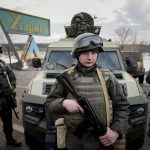 
              Ukrainian National guard soldiers guard a mobile checkpoint together with the Ukrainian Security Service agents and police officers during a joint operation in Kharkiv, Ukraine, Thursday, Feb. 17, 2022. Fears of a new war in Europe have resurged as U.S. President Joe Biden warned that Russia could invade Ukraine within days, and violence spiked in a long-running standoff in eastern Ukraine that some fear could be the spark for wider conflict. (AP Photo/Evgeniy Maloletka)
            
