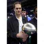 
              FILE - New England Patriots quarterback Tom Brady holds the Super Bowl trophy after the Patriots beat the St. Louis Rams 20-17 in Super Bowl XXXVI at the Louisiana Superdome, Sunday, Feb. 3, 2002, in New Orleans. Tom Brady has retired after winning seven Super Bowls and setting numerous passing records in an unprecedented 22-year-career. He made the announcement, Tuesday, Feb. 1, 2022, in a long post on Instagram. (AP Photo/Doug Mills)
            