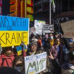 
              People gather in Times Square to denounce the Russian invasion of Ukraine on Saturday, Feb. 26, 2022, in New York. (AP Photo/Brittainy Newman)
            