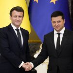 
              French President Emmanuel Macron, left, winks as he shakes hands with Ukrainian President Volodymyr Zelenskyy after a joint news conference following their talks in Kyiv, Ukraine, Tuesday, Feb. 8, 2022. Diplomatic efforts to defuse the tensions around Ukraine continued on Tuesday with French President Emmanuel Macron arriving in Kyiv the day after hours of talks with the Russian leader in Moscow yielded no apparent breakthroughs. (AP Photo/Efrem Lukatsky)
            