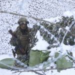 
              The National Guard soldiers take part in tactical exercises, which are conducted by the Ukrainian National Guard, Armed Forces, special operations units and simulate a crisis situation in an urban settlement, in the abandoned city of Pripyat near the Chernobyl Nuclear Power Plant, Ukraine, Friday, Feb. 4, 2022. (AP Photo/Mykola Tymchenko)
            