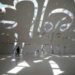 
              A visitor walks in the Museum of the Future, an exhibition space for innovative and futuristic ideas in Dubai, United Arab Emirates, Wednesday, Feb. 23, 2022. Dubai has unveiled an architecturally stunning new museum that envisions what the world could look like 50 years from today. (AP Photo/Kamran Jebreili)
            