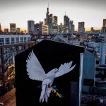 
              A peace mural showing a dove with a branch in Ukrainian colors by artist Justus Becker is painted on the wall of a house in Frankfurt, Germany, Monday, Feb. 28, 2022. (AP Photo/Michael Probst)
            
