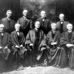 
              FILE - With the addition of the Supreme Court's newest member, Associate Justice Louis D. Brandeis, top row left, the high court sits for a new group photograph in 1917 in New York.  Standing from left are, Associate Justice Louis D. Brandeis, Associate Justice Mahlon Pitney, Associate Justice James C. McReynolds and Associate Justice John H. Clarke. Seated from left are, Associate Justice William R. Day, Associate Justice Joseph McKenna, Chief Justice Edward D. White, Associate Justice Oliver Wendell Holmes, and Associate Justice W. Van Devanter. (AP Photo, File)
            