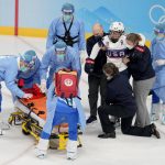 
              United States' Brianna Decker is helped off the ice after being injured during a preliminary round women's hockey game against Finland at the 2022 Winter Olympics, Thursday, Feb. 3, 2022, in Beijing. (AP Photo/Petr David Josek)
            