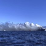 
              Thick smoke rises from the Italy-flagged Euroferry Olympia as it burns for a second day at the Ionian Sea, off the port of Corfu island, northwestern Greece, Saturday, Feb. 19, 2022. Rescue teams in Greece searched Saturday for 12 people believed to be missing from a ferry that caught fire in the Ionian Sea while en route to Italy and continued burning for a second day. (Voula Pappa/InTime News via AP)
            