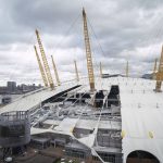 
              A view of damage to the roof of the O2 Arena, caused by Storm Eunice, in south east London, Friday, Feb. 18, 2022.  London Fire Brigade said that there were no reports of any injuries as around 1,000 people were evacuated from the building, formerly known as the Millennium Dome, which hosts major events including concerts and features restaurants, bars, shops and a cinema. Millions of Britons were urged to cancel travel plans and stay indoors Friday amid fears of high winds and flying debris as the second major storm in the week prompted a rare "red" weather warning across southern England. (Stefan Rousseau/PA via AP)
            