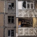 
              A man sits in a damaged flat of a building after a Russian attack on the previous night, at the residential area in Mikolaiv, Ukraine, on Tuesday, March 29, 2022. Ukrainian President Volodymyr Zelenskyy says seven people were killed in a missile strike on the regional government headquarters in the southern city of Mykolayiv. (AP Photo/Petros Giannakouris)
            