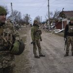 
              Ukrainian soldiers gather near the front line in Brovary, on the outskirts of Kyiv, Ukraine, Monday, March 28, 2022. (AP Photo/Rodrigo Abd)
            