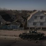 
              A destroyed tank is seen after battles between Ukrainian and Russian forces on a main road near Brovary, north of Kyiv, Ukraine, Thursday, March 10, 2022. (AP Photo/Felipe Dana)
            