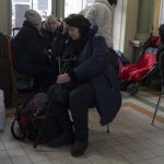 
              People who fled the war in Ukraine wait at Przemysl train station in Przemysl, Poland, Tuesday, March 15, 2022. (AP Photo/Petros Giannakouris)
            