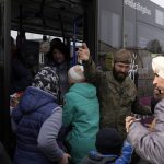 
              A Polish soldier gives directions to Ukrainian refugees upon their arrival at border crossing in Medyka, southeastern Poland, on Wednesday, March 30, 2022. The U.N. refugee agency says more than 4 million people have now fled Ukraine following Russia's invasion, a new milestone in the largest refugee crisis in Europe since World War II. (AP Photo/Sergei Grits)
            