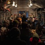 
              Displaced Ukrainians onboard a Poland bound train in Lviv, western Ukraine, Sunday, March 13, 2022. Lviv in western Ukraine itself so far has been spared the scale of destruction unfolding to its east and south. The city's population of 721,000 has swelled during the war with residents escaping bombarded population centers and as a waystation for the nearly 2.6 million people who have fled the country. (AP Photo/Bernat Armangue)
            