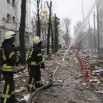 
              Firefighters extinguish a building of Ukrainian Security Service (SBU) after a rocket attack in Kharkiv, Ukraine's second-largest city, Ukraine, Wednesday, March 2, 2022. Russia's assault on Kharkiv, Ukraine's second largest city, continued Wednesday, with a Russian strike hitting the regional police and intelligence headquarters, according to the Ukrainian state emergency service. (AP Photo/Andrew Marienko)
            