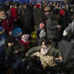 
              People crowd on a platform as they wait to board a Lviv-bound train in Kyiv, Ukraine, Tuesday, March 1, 2022. (AP Photo/Emilio Morenatti)
            