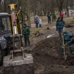 
              Ukrainian volunteers remove rubble to open up an abandoned shelter, in Lviv, western Ukraine, Thursday, March 3, 2022. Russian forces have seized a strategic Ukrainian seaport and besieged another. Those moves are part of efforts to cut the country off from its coastline even as Moscow said Thursday it was ready for talks to end the fighting.  (AP Photo/Bernat Armangue)
            