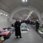 
              People gather in the Kyiv subway, using it as a bomb shelter in Kyiv, Ukraine, Wednesday, March 2, 2022. Russian forces have escalated their attacks on crowded cities in what Ukraine's leader called a blatant campaign of terror. (AP Photo/Efrem Lukatsky)
            