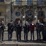
              Members of a chorus sing during a concert organized by the Lviv National Philharmonic in downtown Lviv, western Ukraine, Tuesday, March 22, 2022. The U.N. refugee agency says more than 3.5 million people have fled Ukraine since Russia's invasion, passing another milestone in an exodus that has led to Europe's worst refugee crisis since World War II. (AP Photo/Bernat Armangue)
            