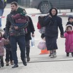 
              People fleeing from Ukraine cross the border in Vysne Nemecke, Slovakia, Friday, March 4, 2022. More than 1 million people have fled Ukraine following Russia's invasion in the swiftest refugee exodus in this century, the United Nations said Thursday. (AP Photo/Darko Vojinovic)
            