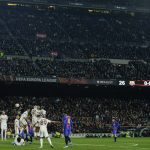 
              Barcelona's Memphis Depay, second right, kicks a free kick during the Europa League, round of 16, first leg soccer match between FC Barcelona and Galatasaray at the Camp Nou stadium in Barcelona, Spain, Thursday, March 10, 2022. (AP Photo/Joan Monfort)
            