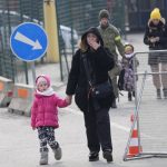 
              People fleeing from Ukraine cross the border in Vysne Nemecke, Slovakia, Friday, March 4, 2022. More than 1 million people have fled Ukraine following Russia's invasion in the swiftest refugee exodus in this century, the United Nations said Thursday. (AP Photo/Darko Vojinovic)
            