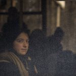 
              A woman sits in a bus as she is evacuated from Irpin, on the outskirts of Kyiv, Ukraine, Wednesday, March 9, 2022. (AP Photo/Felipe Dana)
            