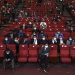 
              Members of the Democratic Party of Korea react as they watch a television report on an exit poll of the new president at the party's situation auditorium in the National assembly on Wednesday, March 9, 2022 in Seoul, South Korea. (Chung Sung-Jun/Pool Photo via AP)
            