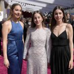 
              Este Haim, from left, Alana Haim, and Danielle Haim arrive at the Oscars on Sunday, March 27, 2022, at the Dolby Theatre in Los Angeles. (AP Photo/John Locher)
            