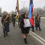 
              Servicemen carry a portrait of Col. Vladimir Zhoga, commander of a reconnaissance battalion of the self-proclaimed Donetsk People Republic during a farewell ceremony in Donetsk, eastern Ukraine, Monday, March 7, 2022. Zhoga has been awarded the Hero of the Russian Federation title posthumously. (AP Photo)
            