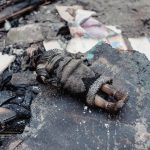 
              A view of a burned doll in a yard of a residential building damaged by shelling, in Chernihiv, Ukraine, Wednesday, March 9, 2022. (AP Photo/Yuriy Vasilenko)
            