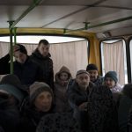 
              Ukrainians enter a bus as they are evacuated from Irpin, on the outskirts of Kyiv, Ukraine, Wednesday, March 9, 2022. (AP Photo/Felipe Dana)
            