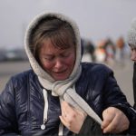 
              A woman fleeing from Ukraine is overcome by emotions at the border crossing in Medyka, Poland, Friday, March 4, 2022. More than 1 million people have fled Ukraine following Russia's invasion in the swiftest refugee exodus in this century, the United Nations said Thursday. (AP Photo/Markus Schreiber)
            