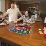
              Nolan Balcitis, left, plays the board game Monopoly with his family at their home in Crown Point, Ind., on March 5, 2022. From left are Nolan, Bryan, Tabitha and Colin Balcitis. Nolan was diagnosed with Type 1 diabetes six months after a mild case of COVID-19. Reports of rising diabetes cases during the pandemic have scientists exploring if there could be a link with the coronavirus. Emerging evidence shows the virus can attack insulin-producing cells in the pancreas, a process that might trigger diabetes in susceptible people. (AP Photo/Teresa Crawford)
            