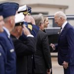 President Joe Biden speaks with Mayor Mattie Parker of Fort Worth, Texas, after stepping off Air Force One at Naval Air Station Joint Reserve Base, Tuesday, March 8, 2022, in Fort Worth, Texas. Biden is in Fort Worth to address access to health care and benefits for veterans affected by military environmental exposures. (AP Photo/Patrick Semansky)